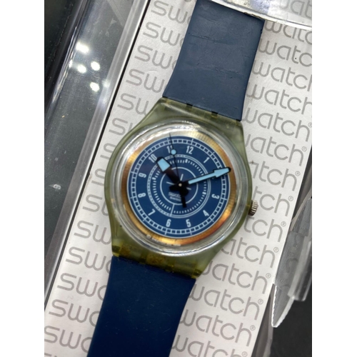 784 - A boxed Swatch watch