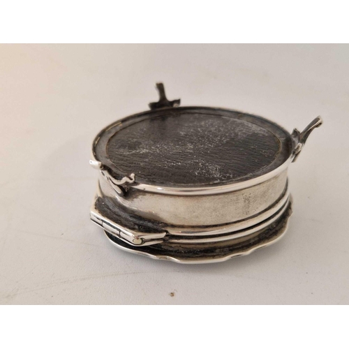 801 - A circular ring box standing on three scroll feet, hinged cover, 2 3/4