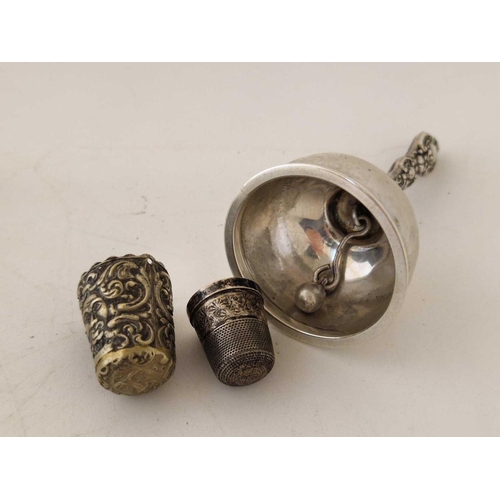 816 - A small table bell and two thimbles