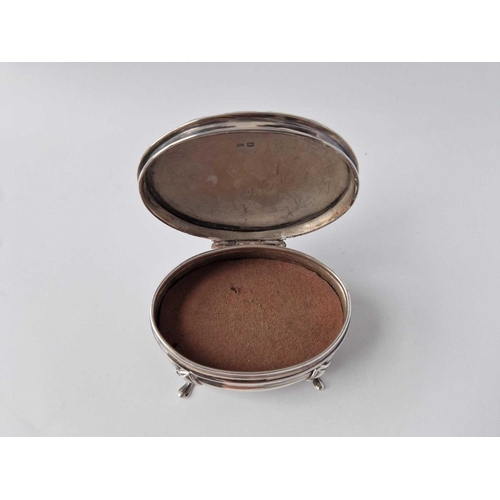 838 - An oval jewel box with hinged cover and four pad feet, 3.5