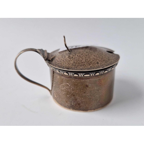 849 - A circular mustard pot with scroll handle, Birmingham 1934, 53g excluding B.G.L