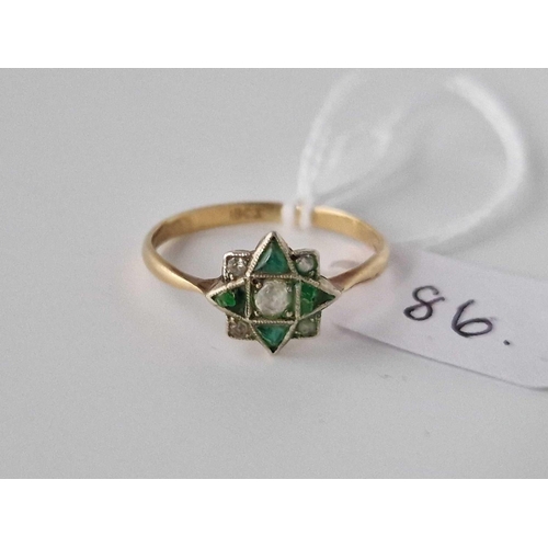 86 - A diamond and emerald ring 18ct gold AF size Q 1.8 gms