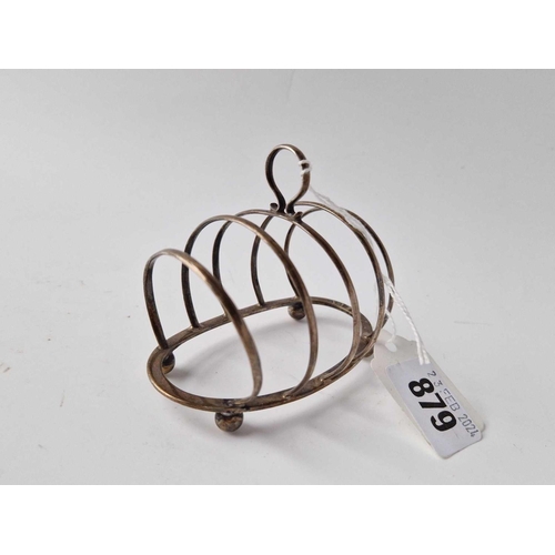 879 - Oval five bar toast rack with ring handle Birmingham 1914 By G U. 51 gms