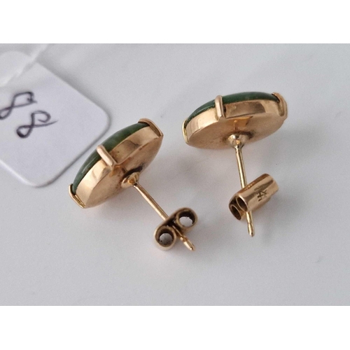 88 - A pair of green stone ears studs 14ct gold 3.4 gms