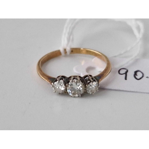 90 - A three stone diamond ring 18ct gold size L