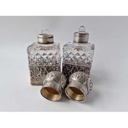 932 - A pair of square scent bottles with screw on covers and cut glass bodies, 5.5