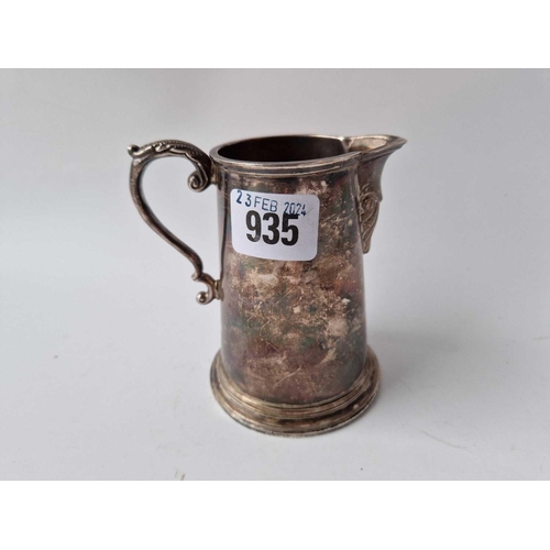 935 - An Irish cream jug with leaf caped handle and rim foot, 4 1/4