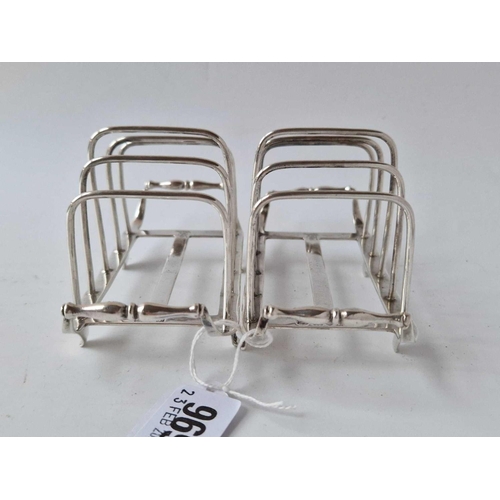 969 - Good pair of crested toast racks on bracket feet. 5 in long. London 1914, 208 gm