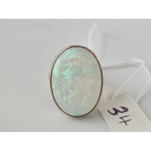 34 - A large silver solitaire opal ring size M 6 gms