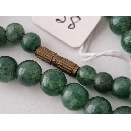 38 - A green hard stone bead necklace 24 inch