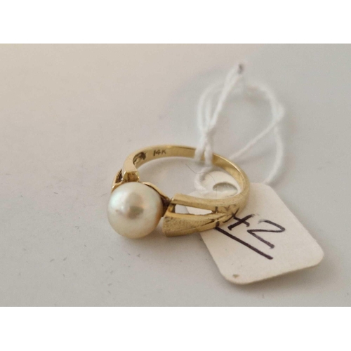 42 - A pearl set ring 14ct gold size N 3.2 gms