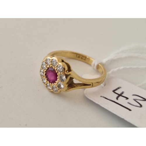 43 - A ruby and diamond cluster ring 18ct gold size I 2.7 g