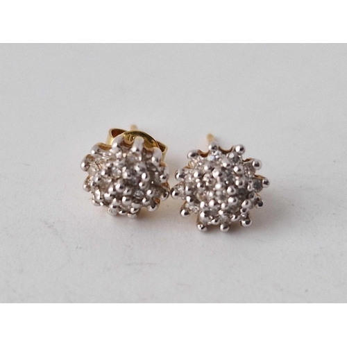 113 - A pair of diamond stud 9ct white gold earrings & a pair of cluster earrings