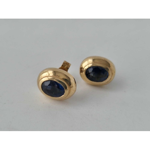 114 - A pair of diamond earrings and a pair of sapphire earrings both 9ct