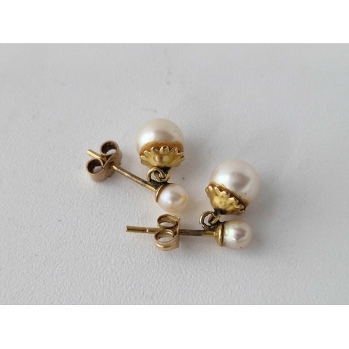 140 - A pair of pearl ear studs, 9ct