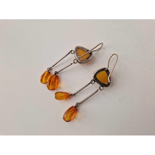 192 - A pair of Russian silver and amber earrings