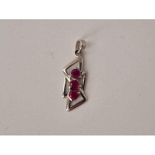 194 - A white gold ruby pendant, 18ct