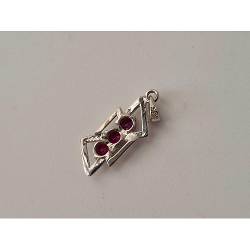 194 - A white gold ruby pendant, 18ct