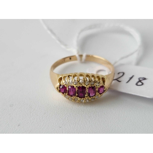 218 - Antique Edwardian 18ct boat shaped ring, set with 5 central rubies, 
surrounded on either side by ro... 