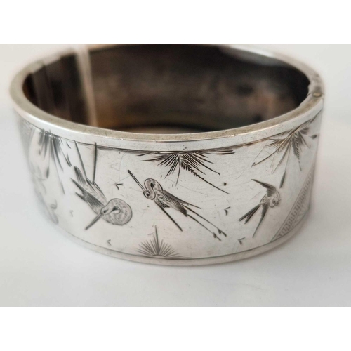 33 - An aesthetic engraved silver bangle, 26 g