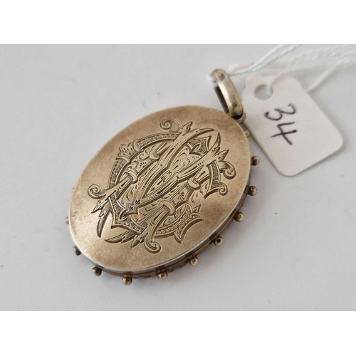 34 - A Victorian silver gilt locket/ pendant, 15.3 g