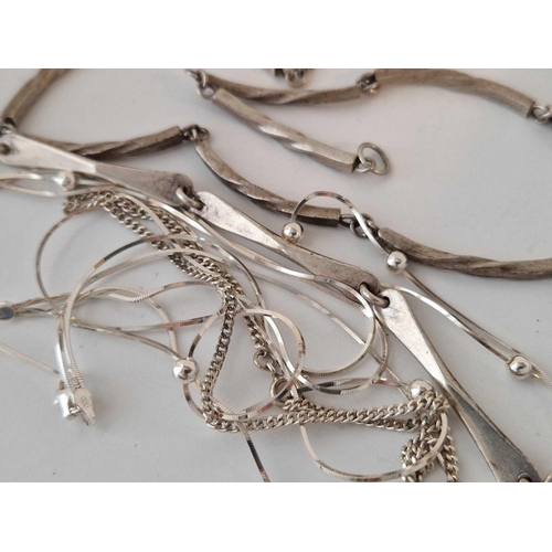 36 - A bag of silver necklaces, chains, etc 84.5 g