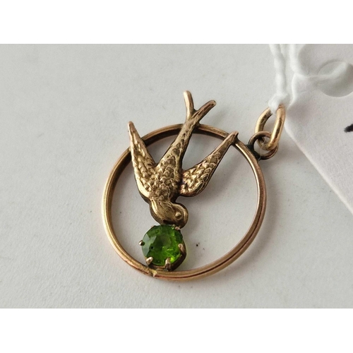 118 - A peridot swallow pendant 9ct