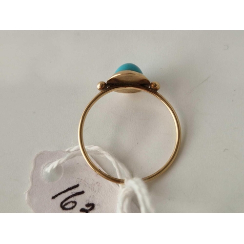 163 - A turquoise ring 14ct gold size N 1.2 gms