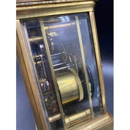 1744 - Another brass repeating carriage clock with repeat button and striking bell. 7 in high By Brook and ... 