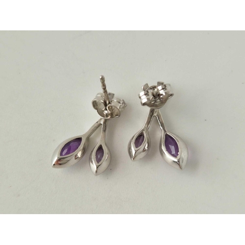 180 - A pair of amethyst ear studs 9ct 2.9 gms