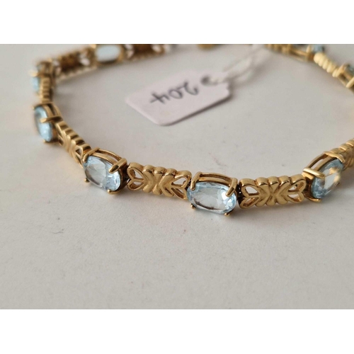 204 - A BLUE TOPAZ BRACELET 9CT 8 INCH 12.1 GMS