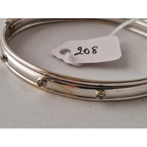 208 - A WHITE GOLD WHITE STONE BANGLE 9CT 10 GMS