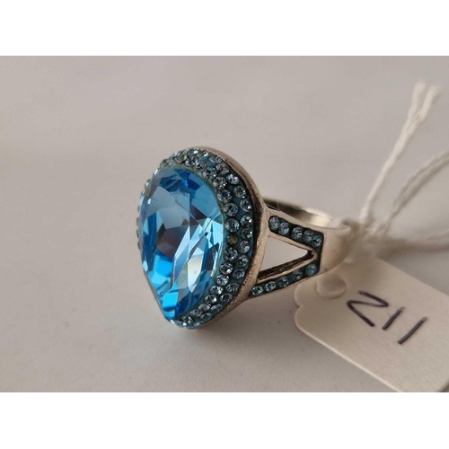 211 - A silver blue stone dress ring