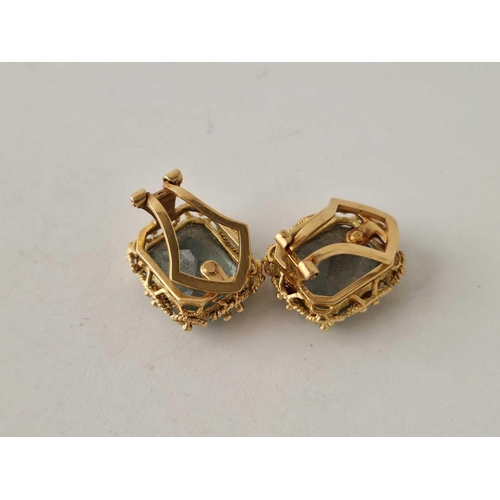 212 - A pair of emerald earrings set in gold 7.7 gms Clip On