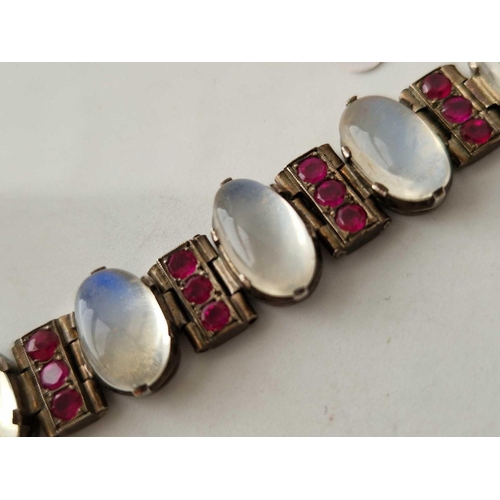 225 - Part of a silver bracelet set with five moonstones and red stones