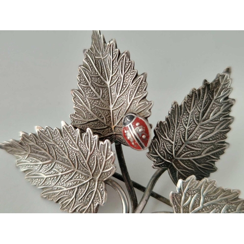 226 - A 1960s silver leaf brooch with ladybird