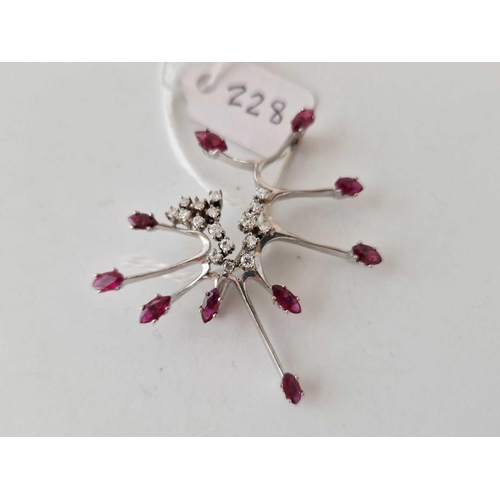 228 - A WHITE GOLD DIAMOND AND RUBY STAR BURST BROOCH 14CT GOLD