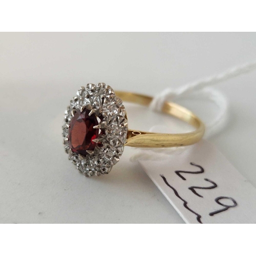 229 - A RUBY AND DIAMOND CLUSTER RING 18CT GOLD SIZE S 4.6 GMS