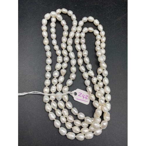 243 - A fancy long chain white pearl necklace 50 inch 94 gms