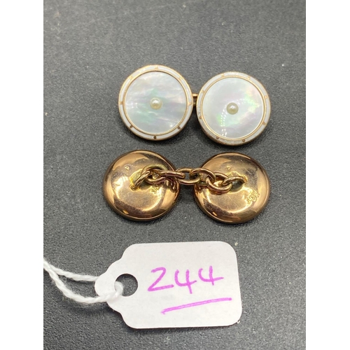 244 - A PAIR OF VINTAGE MOP CUFFLINKS THE OUTER EDGE FINISHED IN FINE CONDITION WHITE ENAMEL SET IN GOLD