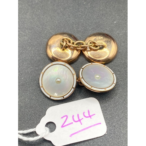 244 - A PAIR OF VINTAGE MOP CUFFLINKS THE OUTER EDGE FINISHED IN FINE CONDITION WHITE ENAMEL SET IN GOLD