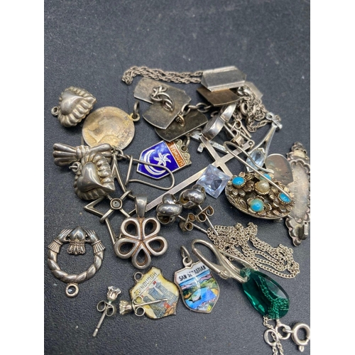 323 - A bag of assorted silver items including cufflinks pendants and earrings