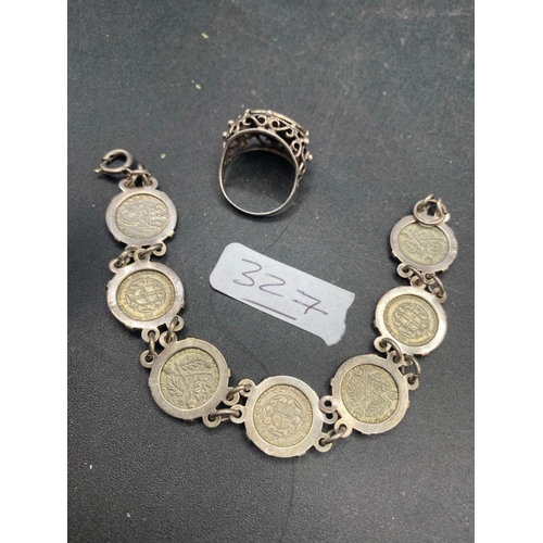 327 - A silver coin bracelet and silver coin ring 25 gms