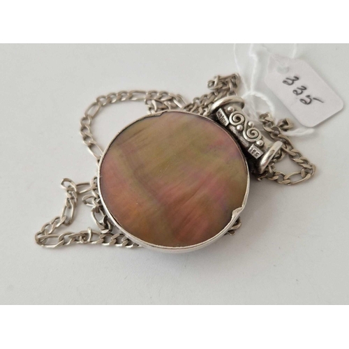 335 - A silver and cats eye moon faced pendant on chain