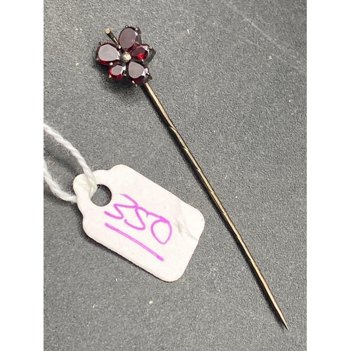 350 - A Georgian flat cut garnet flower stick pin