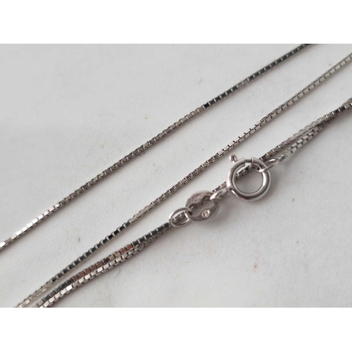 370 - A white gold fine link neck chain 14ct gold 18 inch and a pair of white gold ear clips