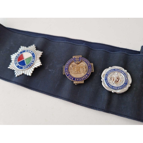 38 - A nurses belt complete with medical badges