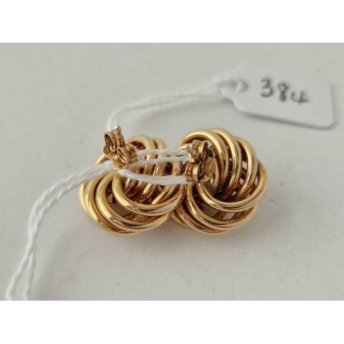 384 - A good pair of swirl knot earring s 9ct 4.8 gms