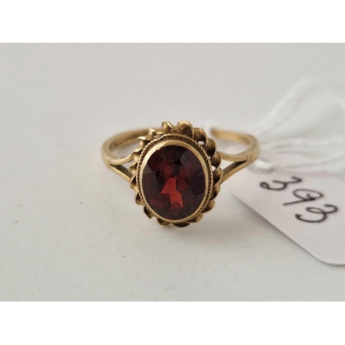 393 - A garnet dress ring 9ct size P 2.4 gms