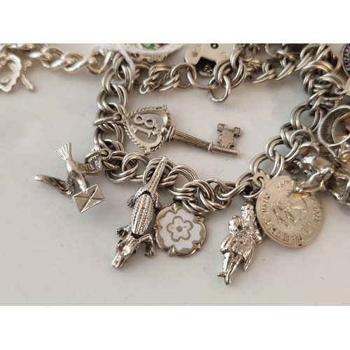 433 - Two silver charm bracelets 71 gms